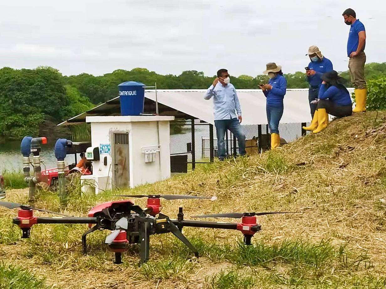 Before working, XAG agricultural drone sits on the slope of cacao plantations