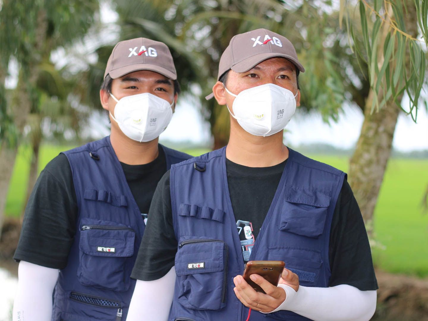 The pilots controlled the drone by phone to provide crop protection service
