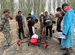 Local farmers and operators discussing drone pollination solution