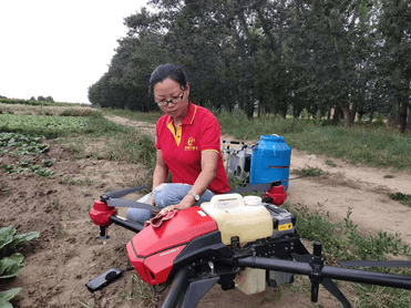 Sheng Guangning and her crop spraying drone